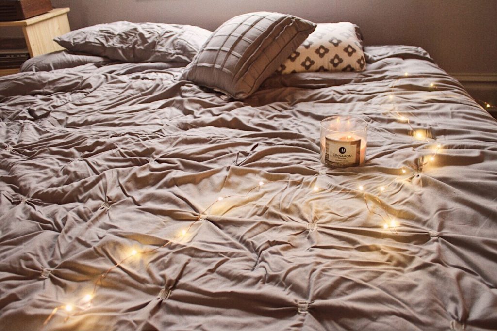 candle on a bed
