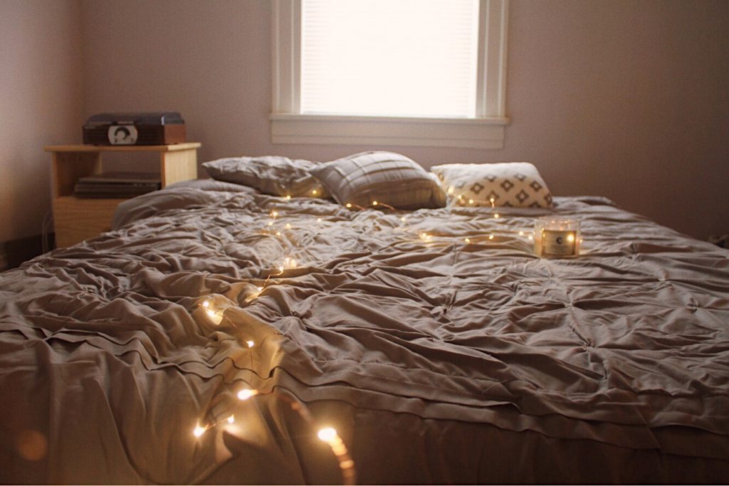 fairy lights and grey bedding