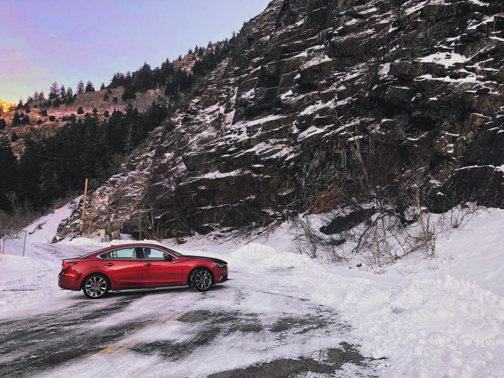 car in canyon in snow