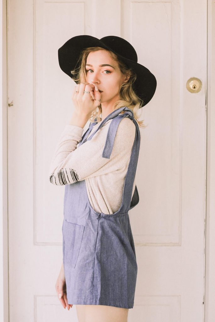 summer overalls and a floppy hat